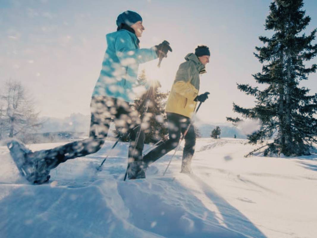 two people hiking snowshoe